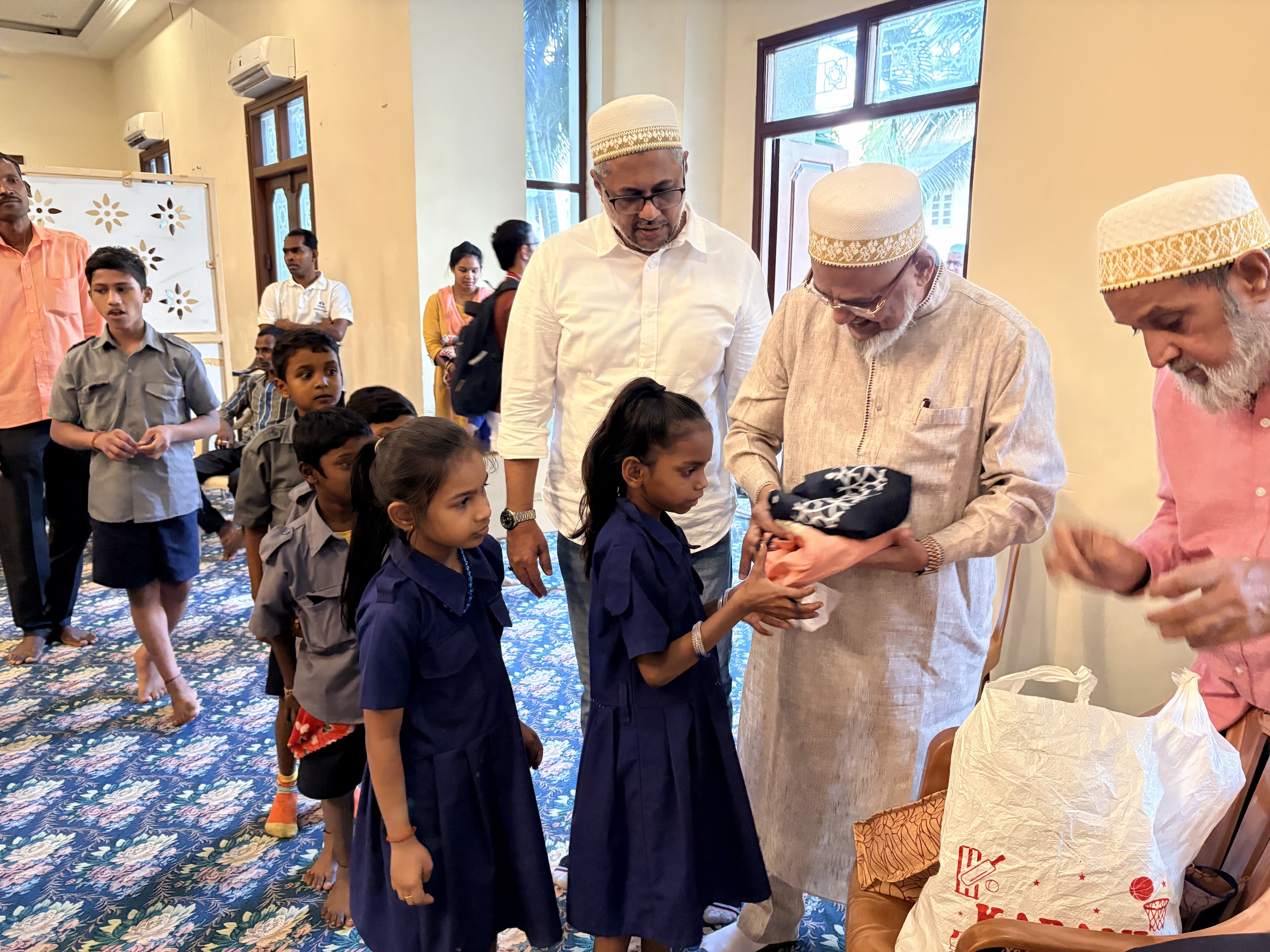 Volunteers and school children at a community outreach event